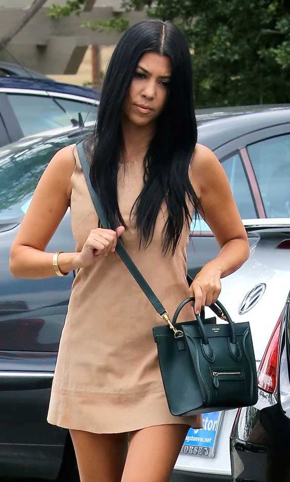 Kourtney Kardashian looking chic with a cross body bag