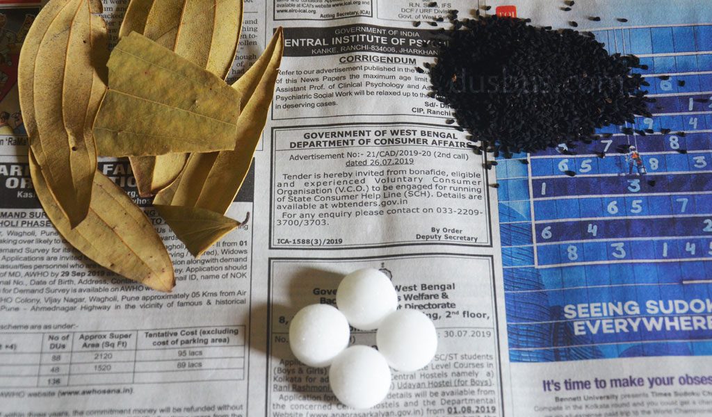 naphthalene, black cumin seeds,bay leaf on paper