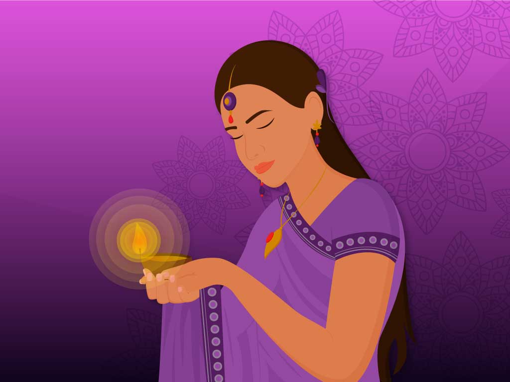 Traditional Indian girl holding a diya