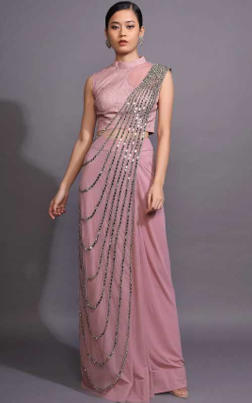 A mauve-pink saree-gown with a mirror work drape