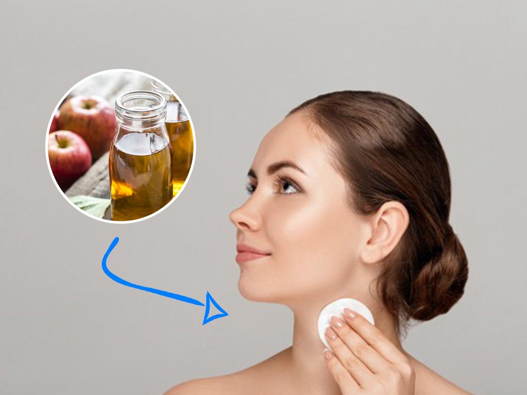 woman applying apple cider vinegar on her neck