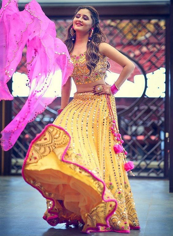 Rashmi Desai In Yellow Mirror Work Lehenga