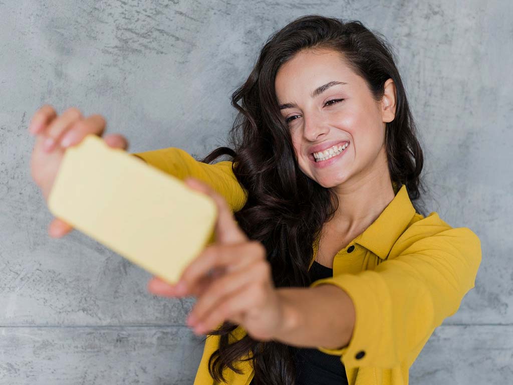 woman taking selfie