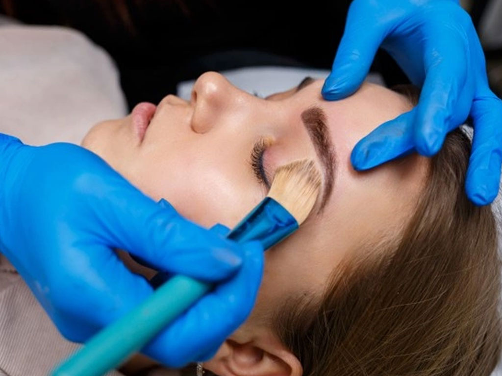 applying powder on eyebrow