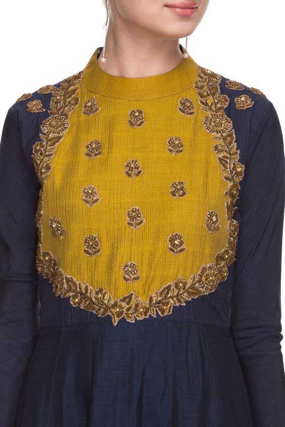 Zari Accentuation Visible In This Glossy Yellow Kurti