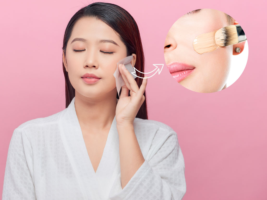 Women Cllean Her Face With Tissue Paper Before Applying Foundation