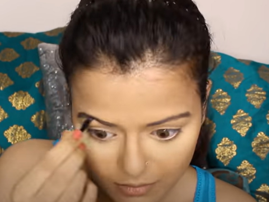 Women Doing Eye Makeup 