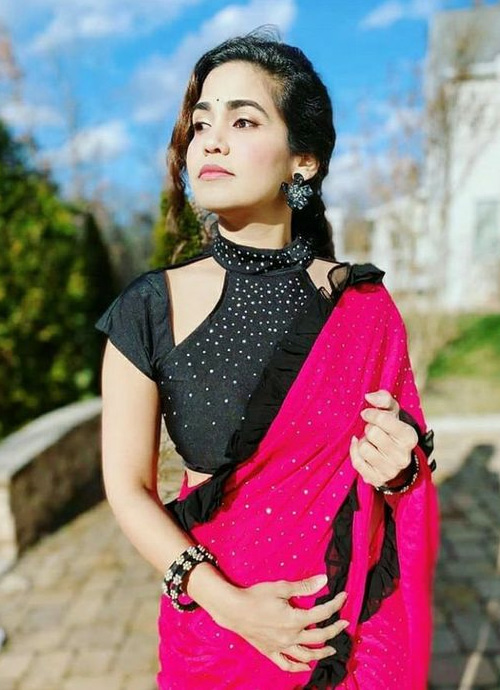 Pink Saree And Black Halter Neck Blouse