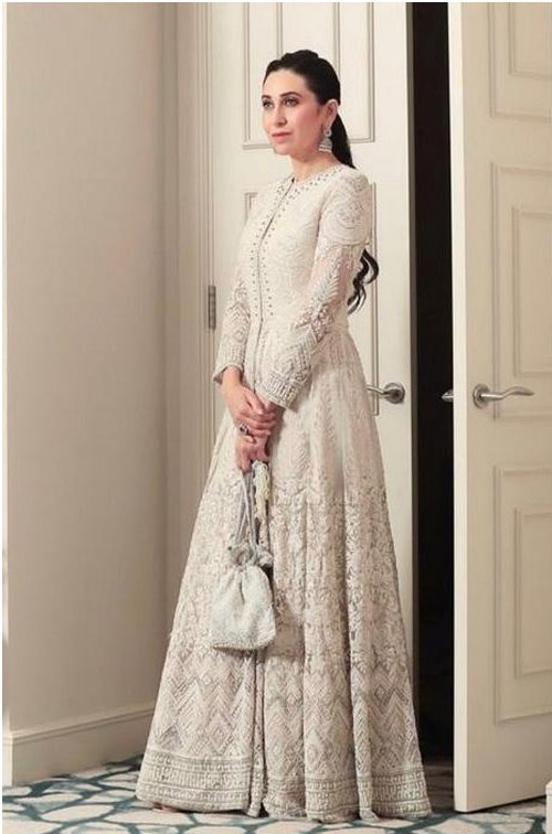 Karishma Kapoor in white dress with bag