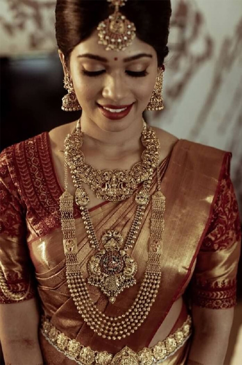 woman wear too many jewellery