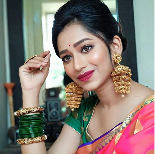 Green Bangles And Golden Kada