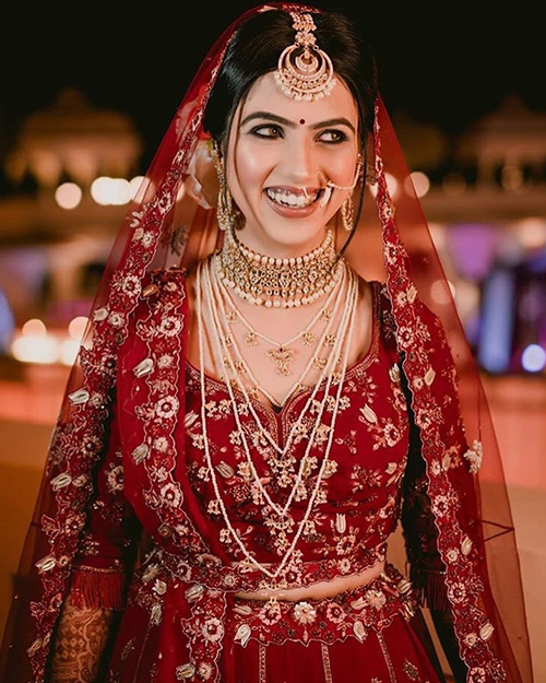 red lehenga with pearl set